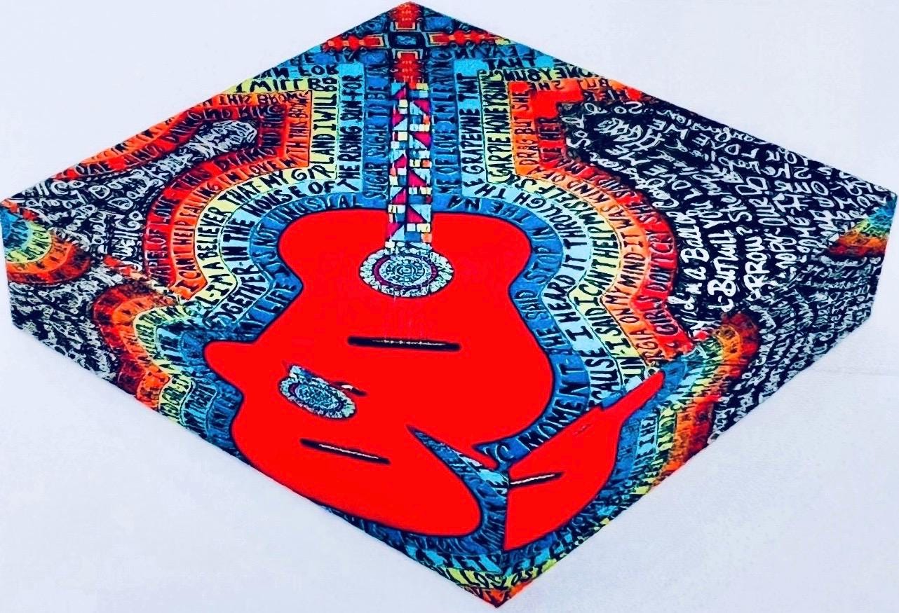 Strummin Glass Paperweight